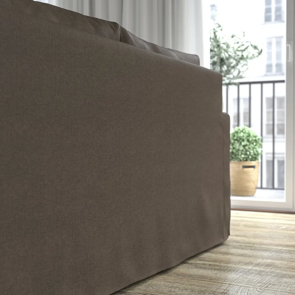Close-up of HYLTARP sofas grey, reversible cushion. Soft, supportive foam and pocket springs enhance comfort. Storage in chaise lounge under seat.