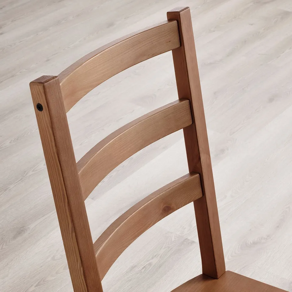 Close-up: sturdy, solid pine chair back, well-crafted with smooth finish.