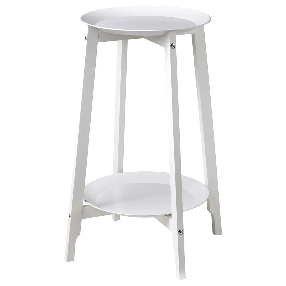 An ALPVIDE white metal plant stand. It has a round metal tray and four legs, providing a sleek, modern design.