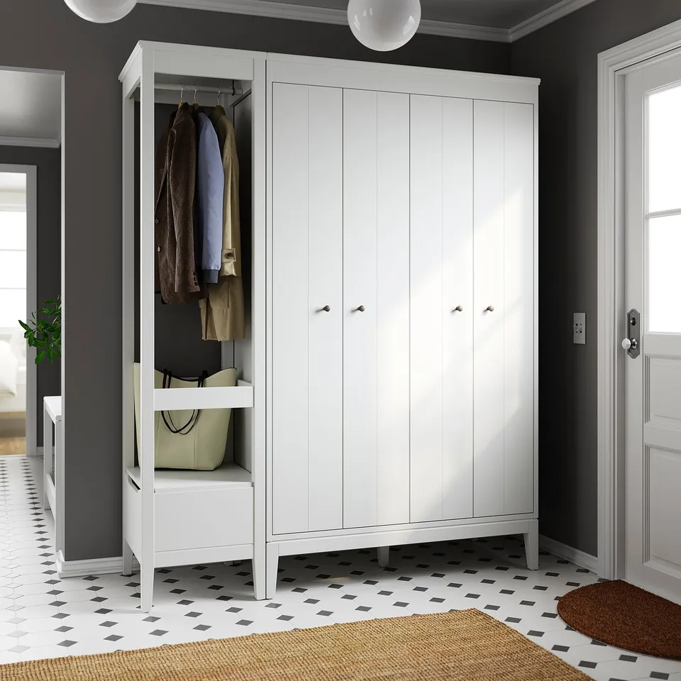 Modern white IDANÄS wardrobe combo with bifold doors and open section for hanging clothes, featuring adjustable shelves.