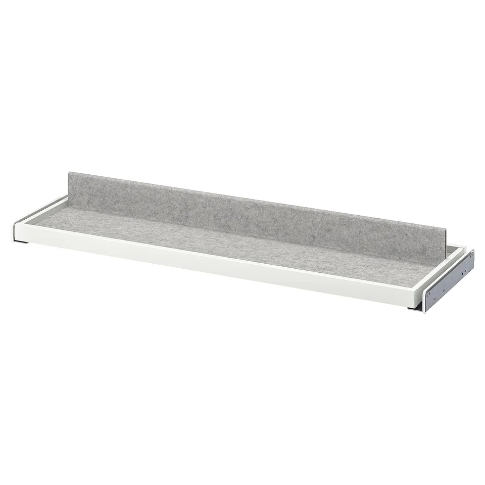 KOMPLEMENT grey pull-out tray, minimalist design, felt lining, water-resistant, white edges.
