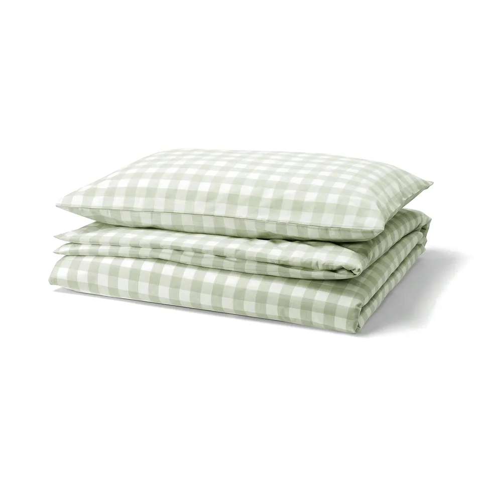 An EKTANDVINGE duvet and pillow set in green gingham check pattern, made of 100% organic cotton.