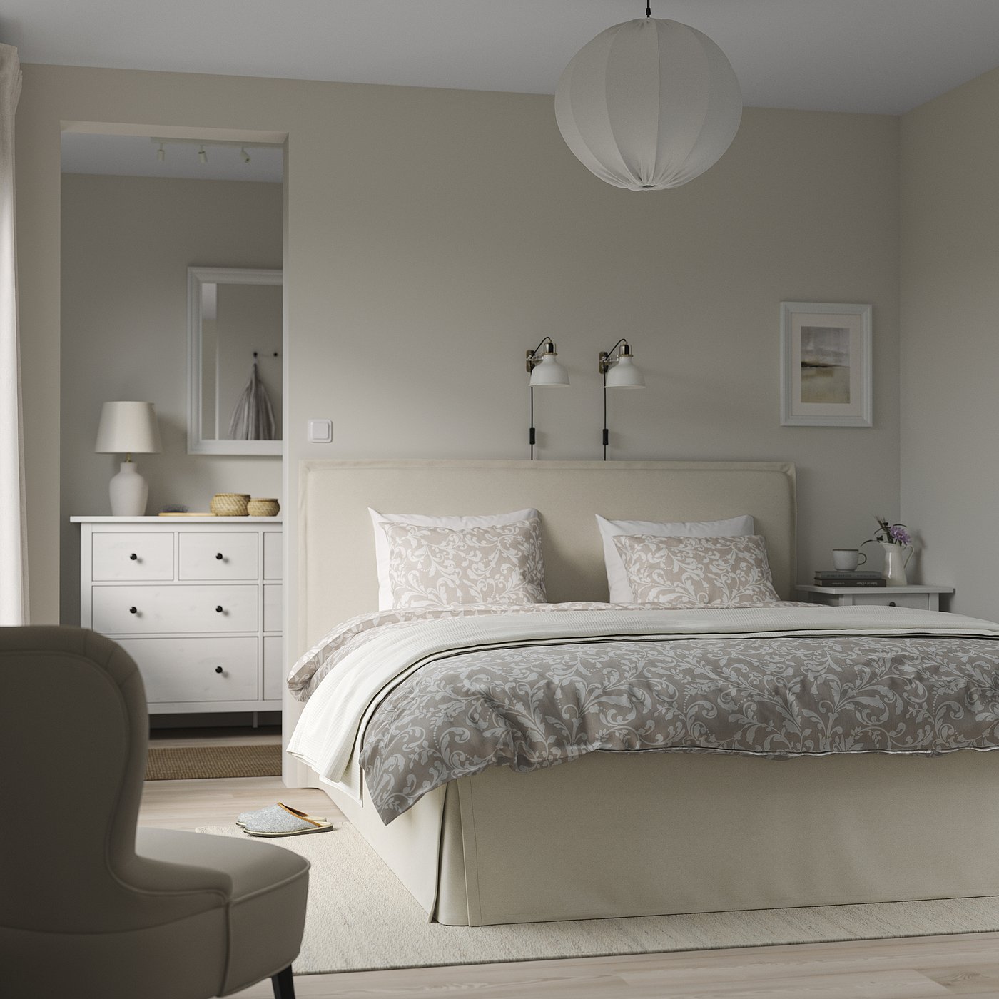 Cosy bedroom with TÄRNKULLEN bed, patterned linens, pendant light, bedside table, dresser, mirror, chair, and bookshelf.