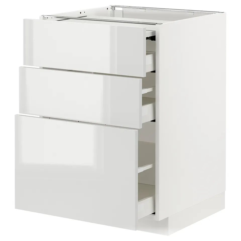 Modern METOD kitchen unit with glossy white drawers, sleek and clean design.