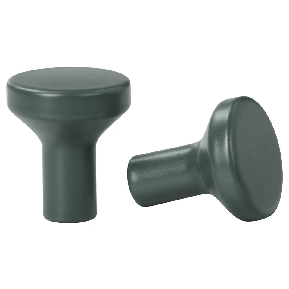 Two grey BAGGANÄS knobs, smooth and rounded, with a modern design, made of coated steel.