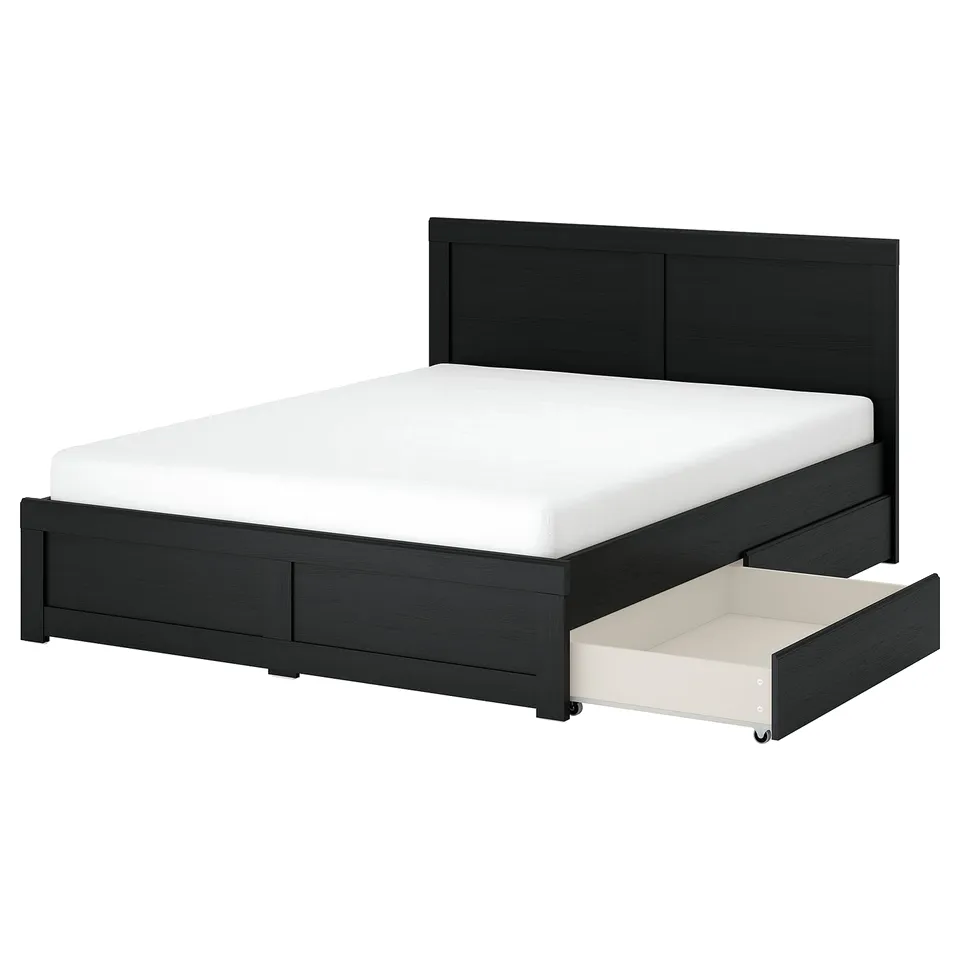 Black FÅGELFJÄLLET bed with white mattress, storage drawers, sleek headboard.