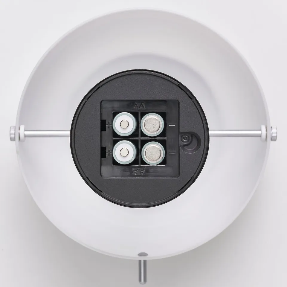 Portable led lamp with battery compartment, usb-c charging port, and warm white light.