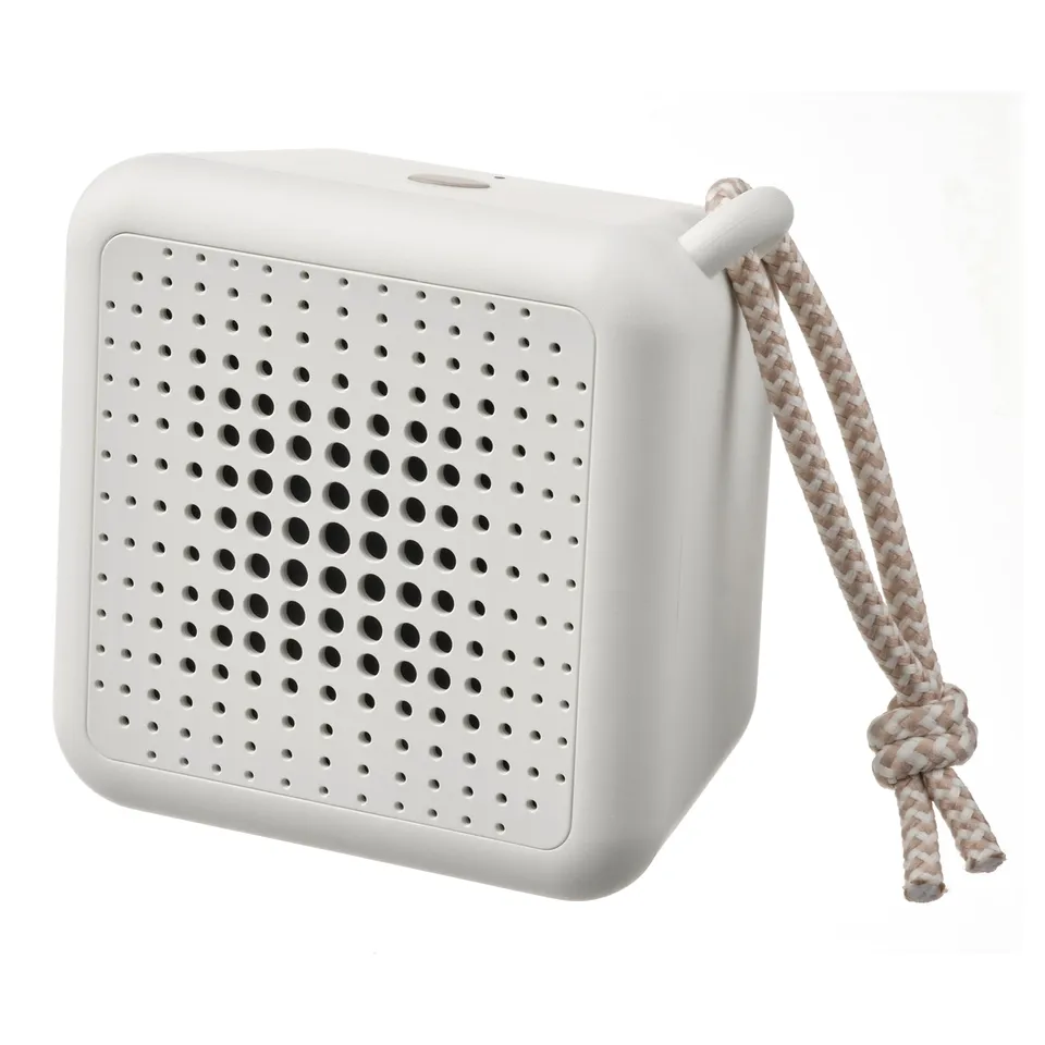 A white, cubic VAPPEBY bluetooth speaker with a braided hanging loop, featuring a grid of holes for sound output and a sleek, modern design.
