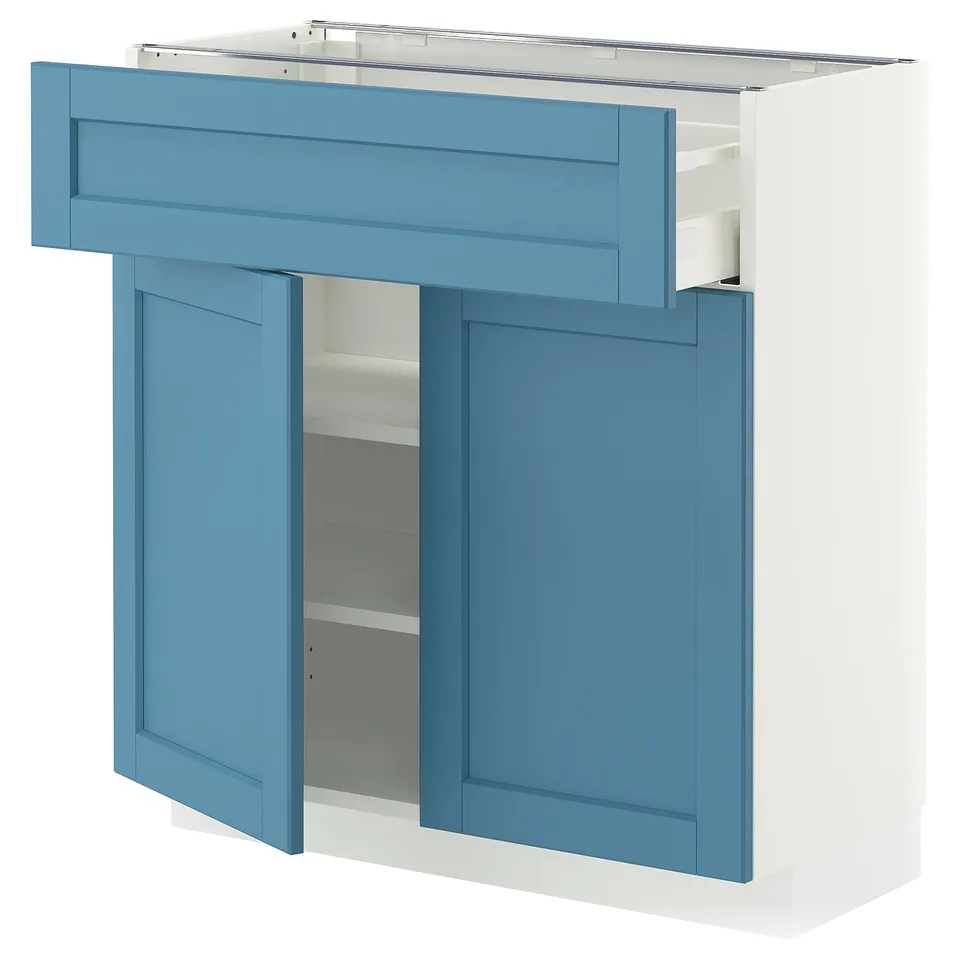 A light blue IKEA METOD kitchen unit with two doors, one drawer, and shelves. The cabinet is rectangular and has a modern design.