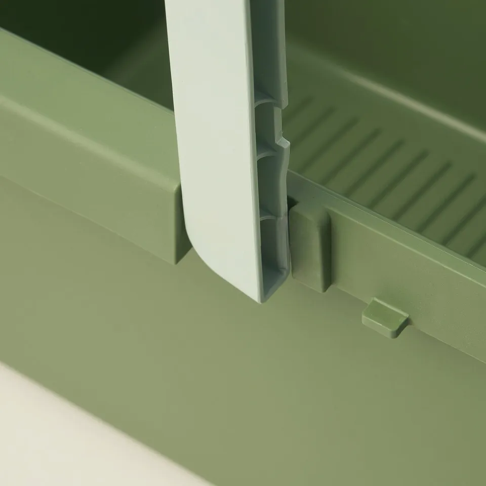A close-up of a green PEPPRIG bucket with a white handle. The handle is securely attached, highlighting the sturdy construction of the bucket.