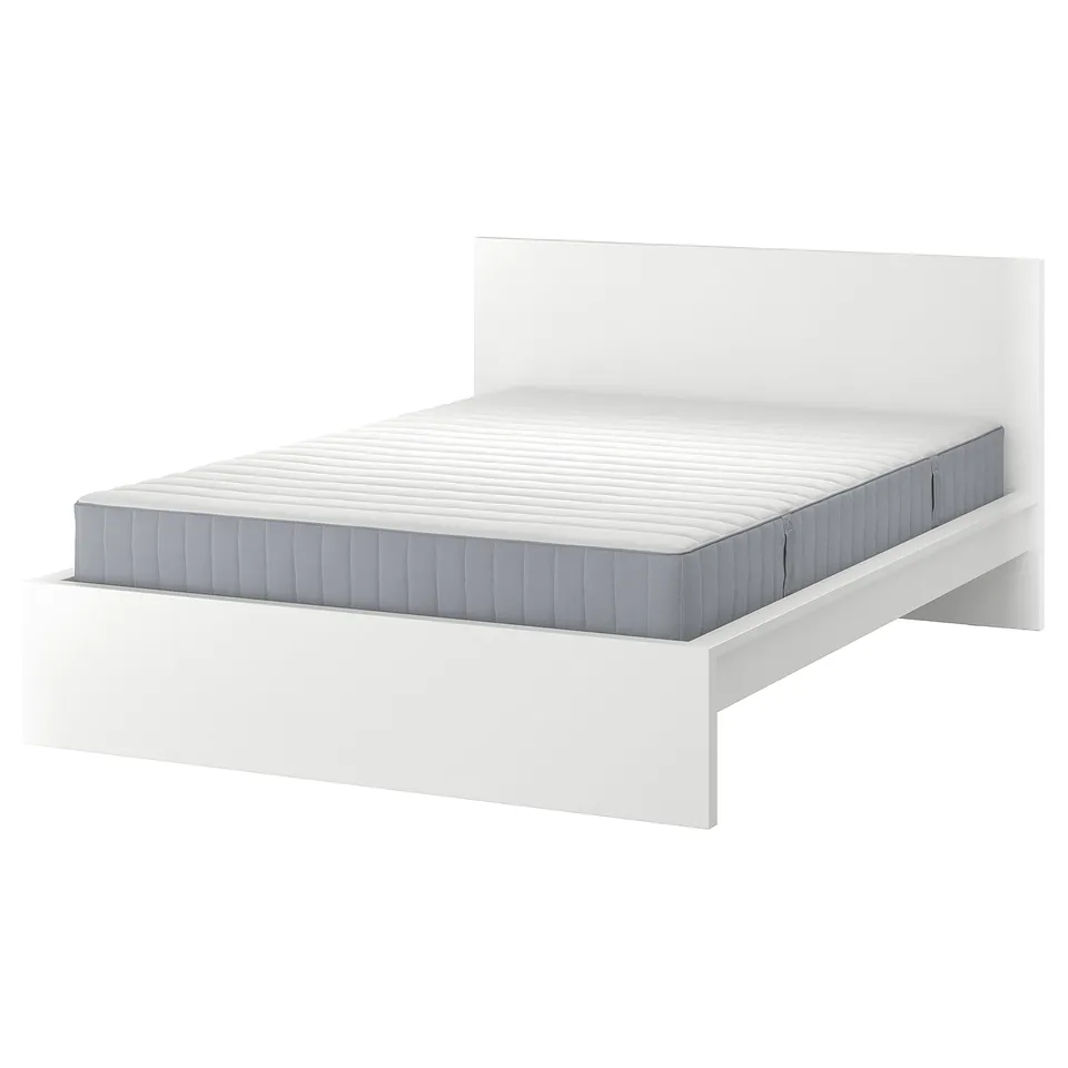 A white MALM bed with a grey mattress. Its simple, modern, and versatile, suitable for various room styles.