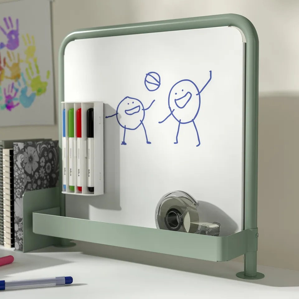 Small green metal desk whiteboard with accessories. Has drawing, markers, and magnet shelf.