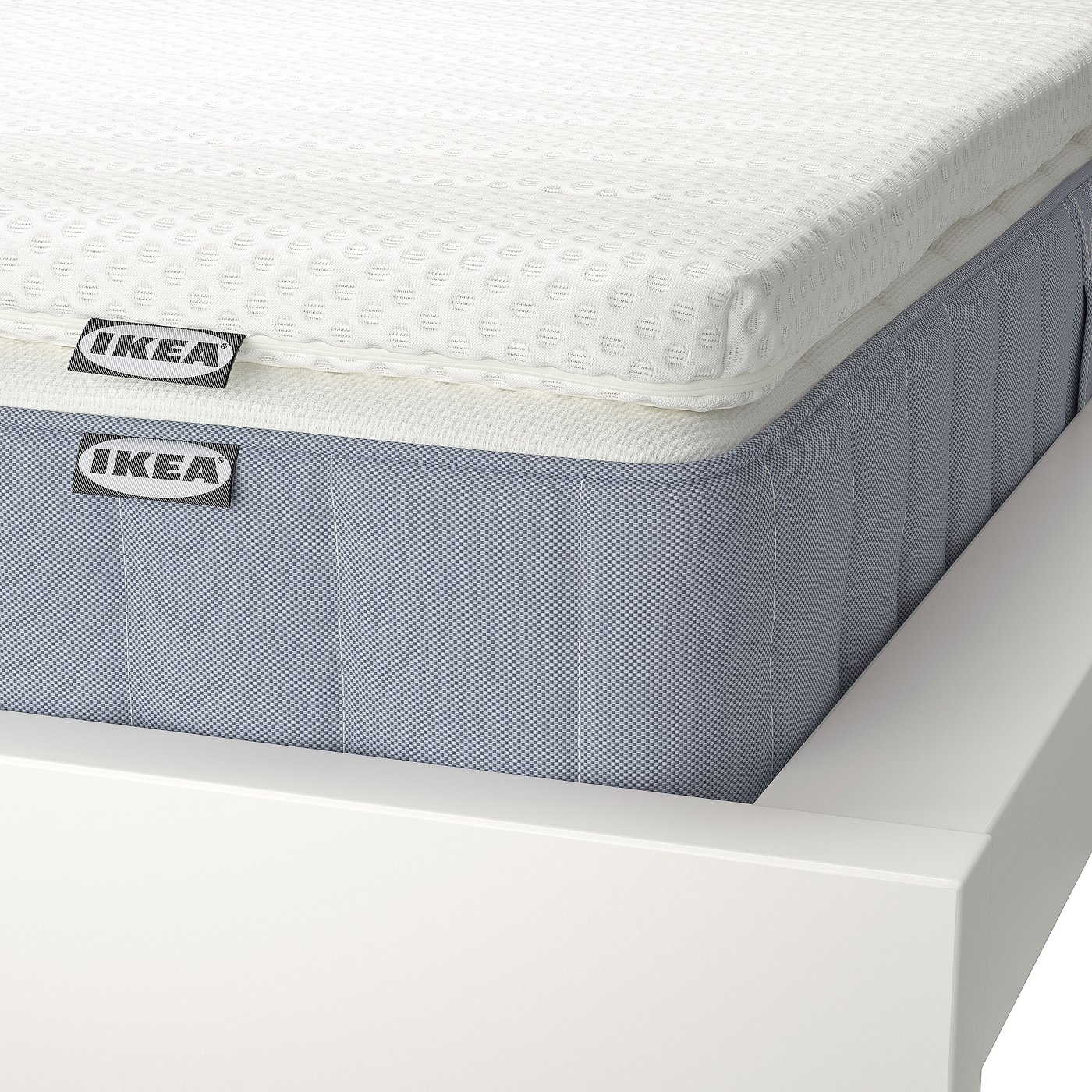 IKEA mattress display: white and blue, quality design, comfort zones, breathable, supportive.