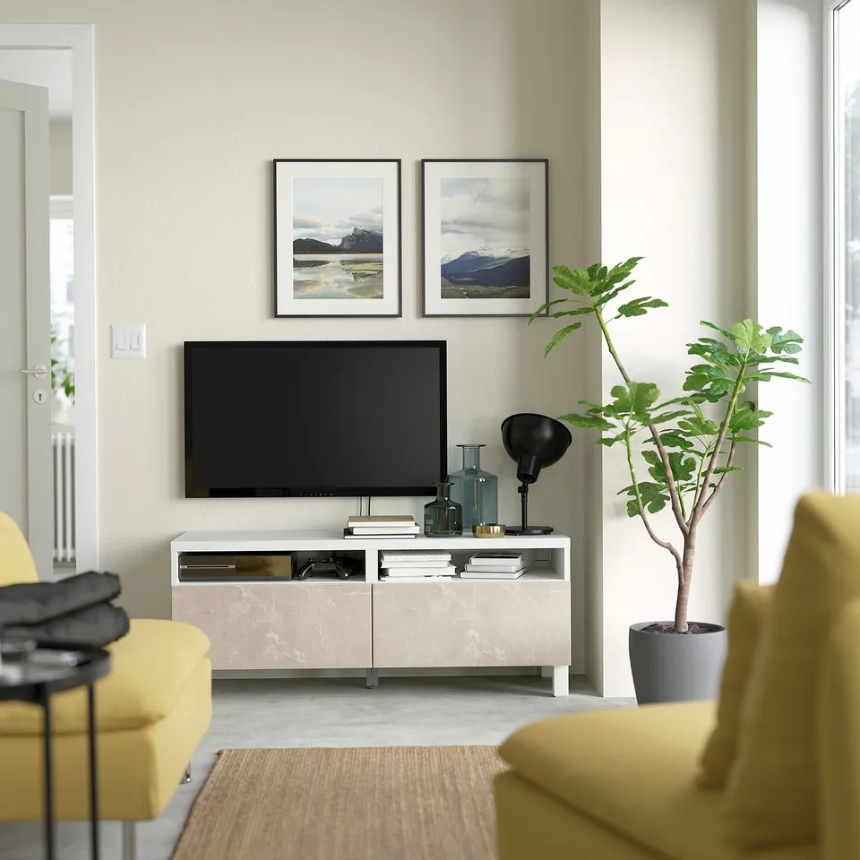 Modern living room with BESTÅ tv stand, featuring cable management, soft-close drawers, and fixed to wall.