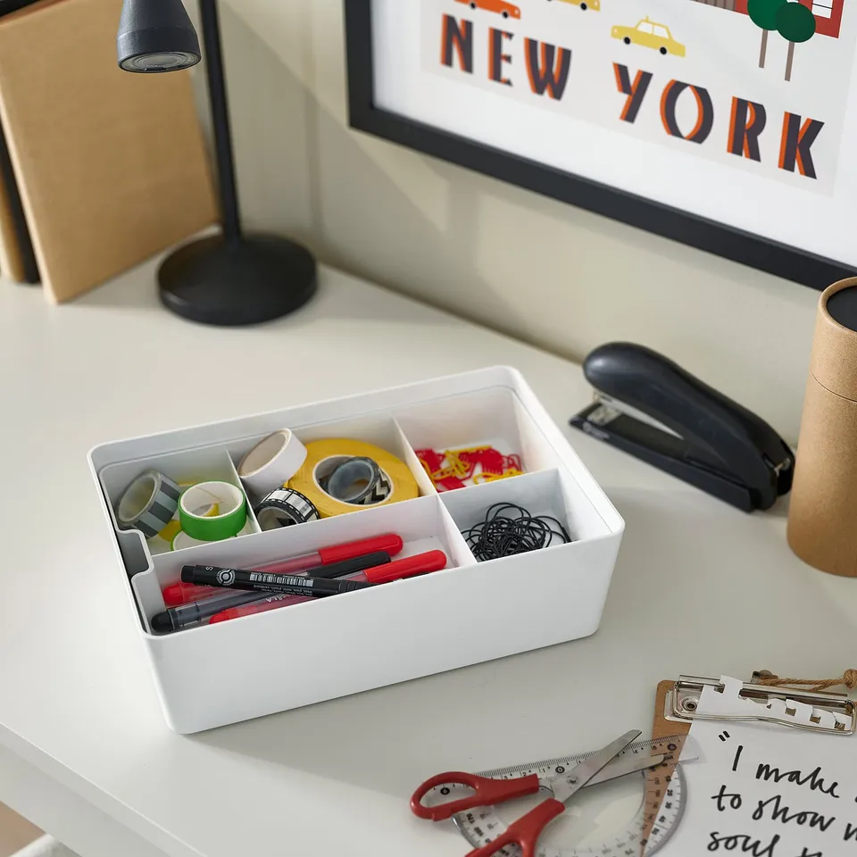 KUGGIS storage box with office supplies on desk.