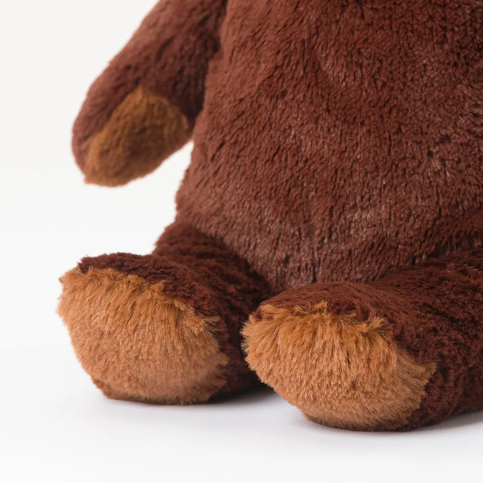 Close-up of soft, huggable teddy bears arm & paw, showcasing quality fabric & craftsmanship.