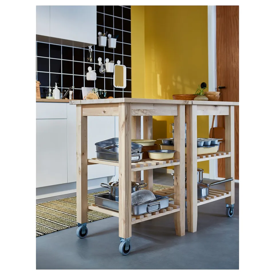Wooden kitchen trolley, BEKVÄM, birch, rectangular, with multiple shelves and wheels.