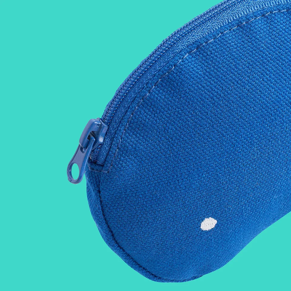 Close-up of blue recycled polyester bag with zip on teal background.