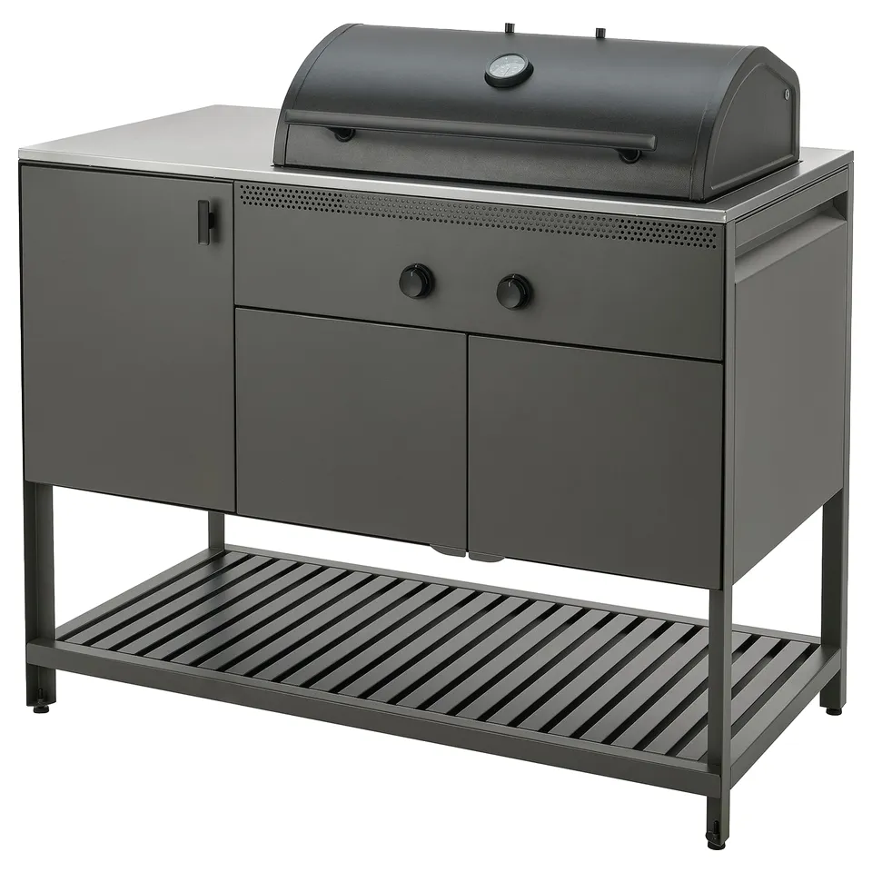 Black BÅTSKÄR outdoor kitchen with cabinet, shelf, and grill, featuring modern, round design and soft-closing hinges.
