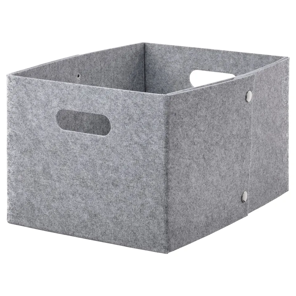 A light grey JÄGMÄSTARE storage box made of 100% polyester, featuring cut-out handles and a square shape, perfect for organising items.