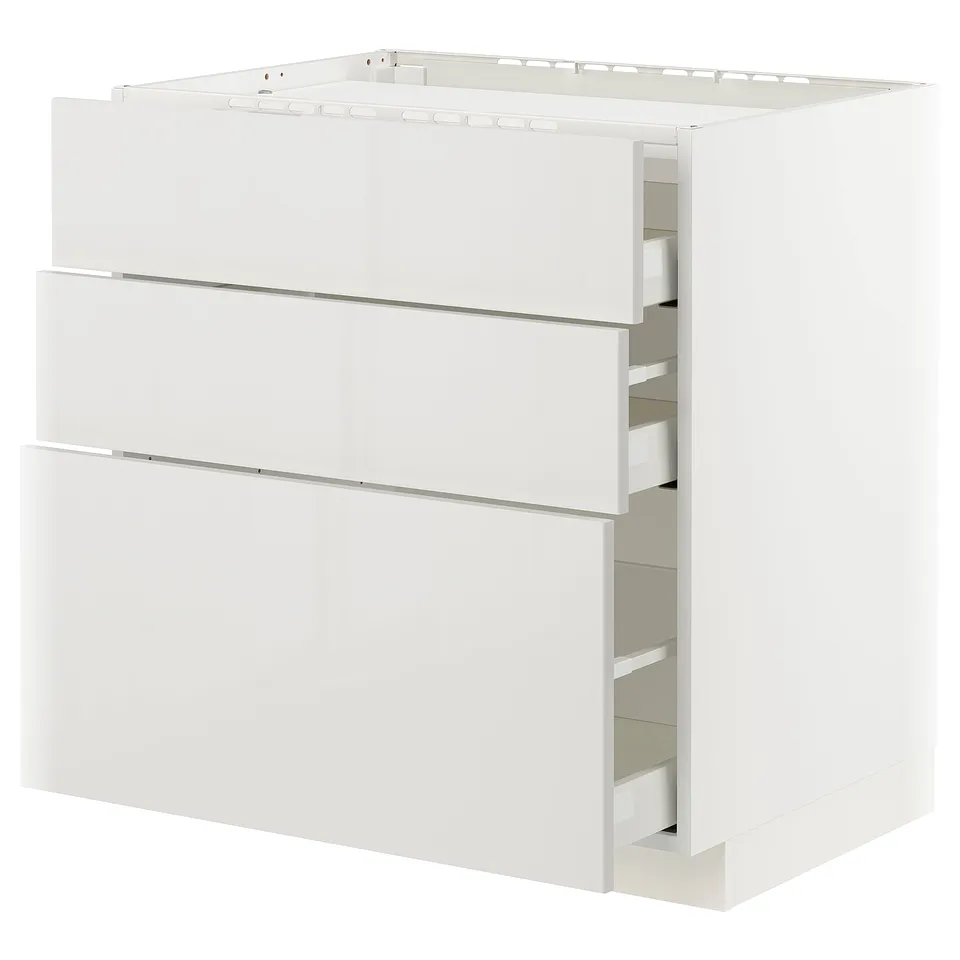 A white METOD kitchen cabinet with multiple drawers in a modern design, featuring a high-gloss finish.