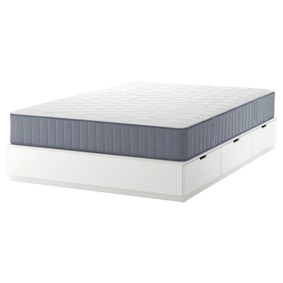 NORDLI white bed frame with 6 drawers and blue-gray mattress. Modern, space-saving design with soft-close drawers.