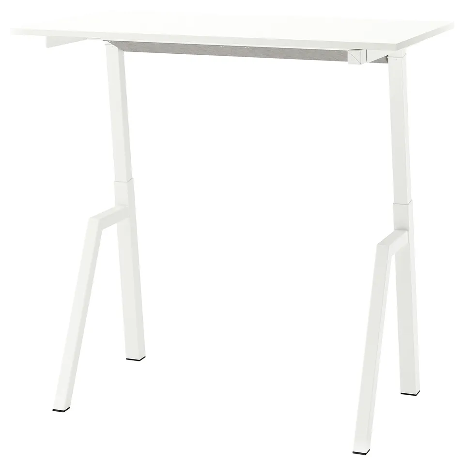 A white TROTTEN standing desk with adjustable legs.