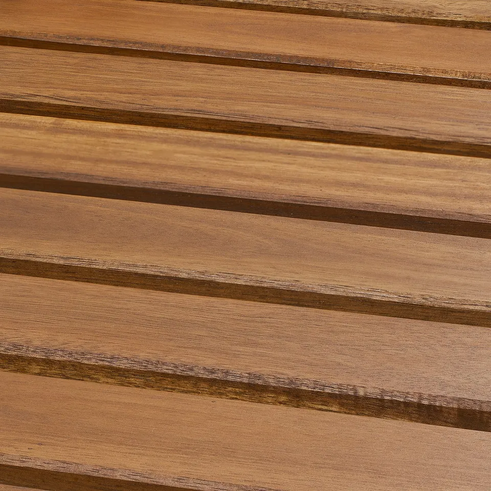 Close-up of smooth, polished wooden planks, likely part of durable outdoor furniture. Shows fine grain and quality finish.