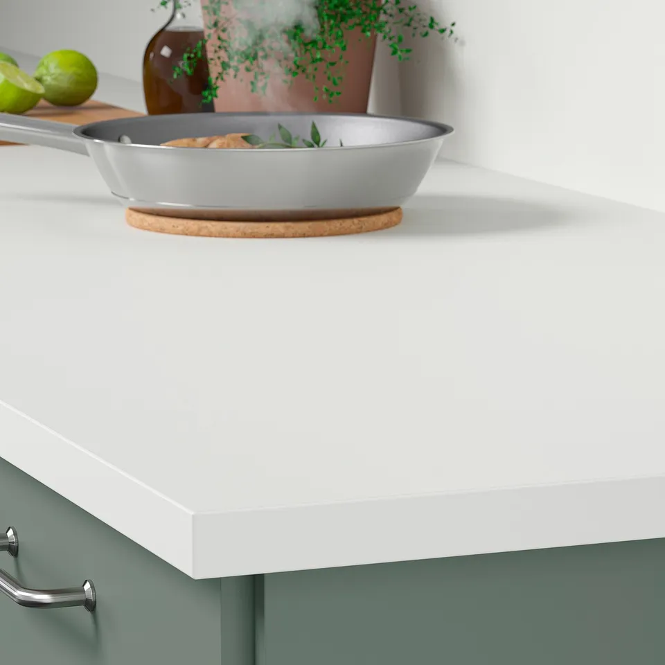 Kitchen countertop with frying pan; easy clean, durable laminate.