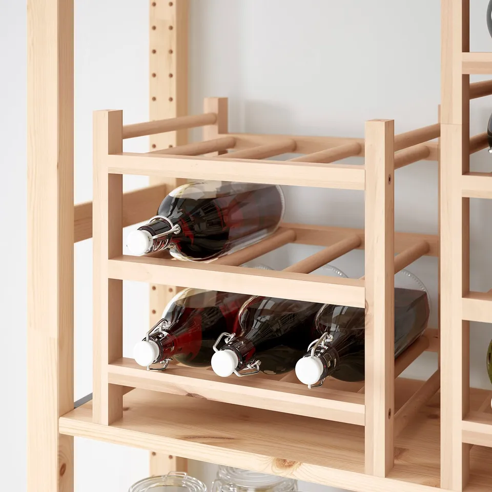 Wooden wine rack holding six bottles, part of the HUTTEN series, designed for stacking and easy painting.