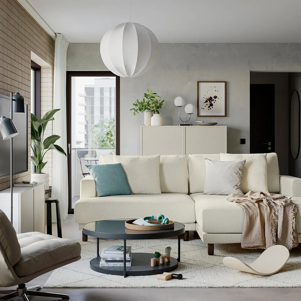 Modern living room with white FRÖTORP sofa, black round side table, and large window.