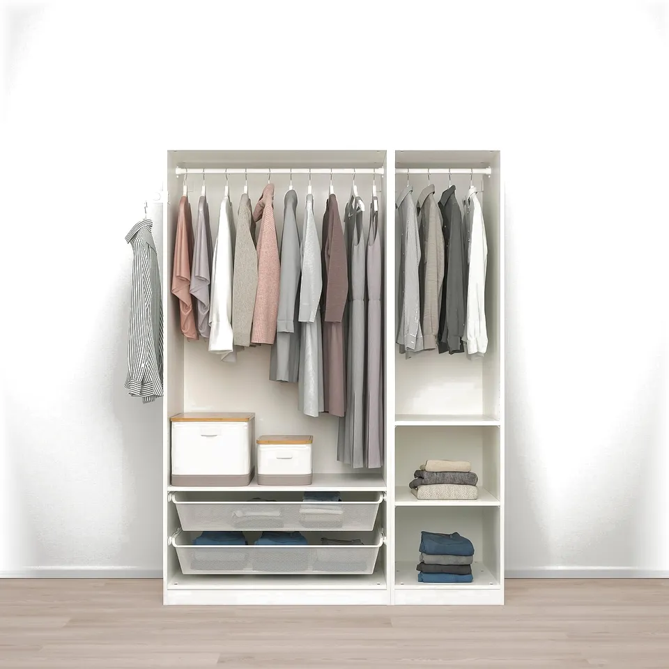 Open wardrobe displaying clothes, folded items, and storage boxes. Adjustable shelves and hanging space, optimised for efficient closet organisation.