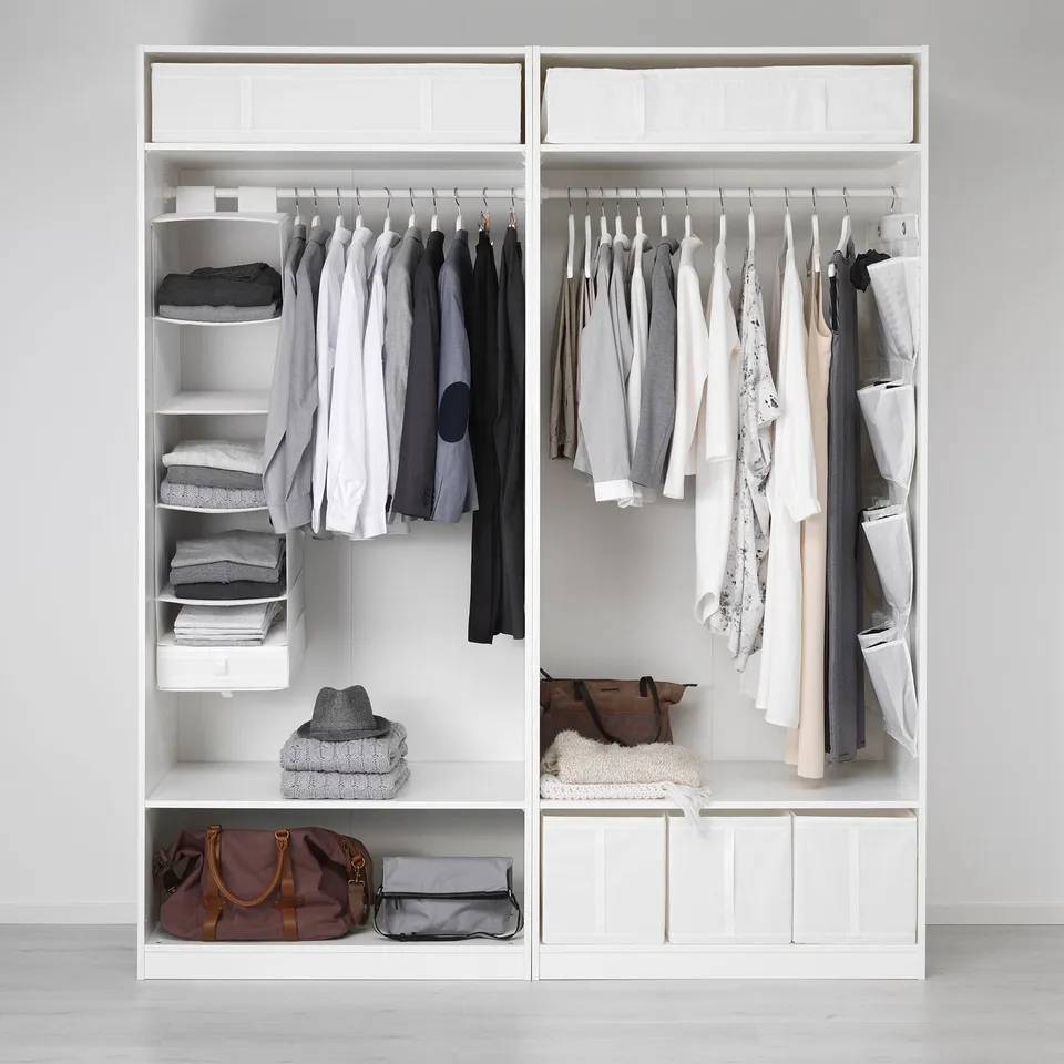 Organised wardrobe with clothes, accessories in SKUBB boxes, and drawers, maximising storage.