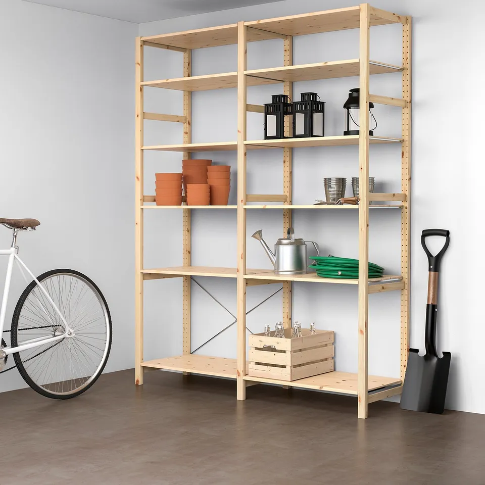 Large IVAR pine wooden storage. Holds various garden items, pots, and tools. Tall, rectangular, sturdy shelves, fits well with bike and shovel.