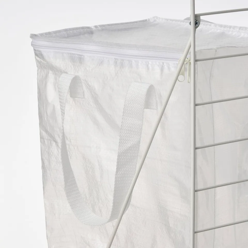White mesh laundry bag with zip and handles on metal frame.