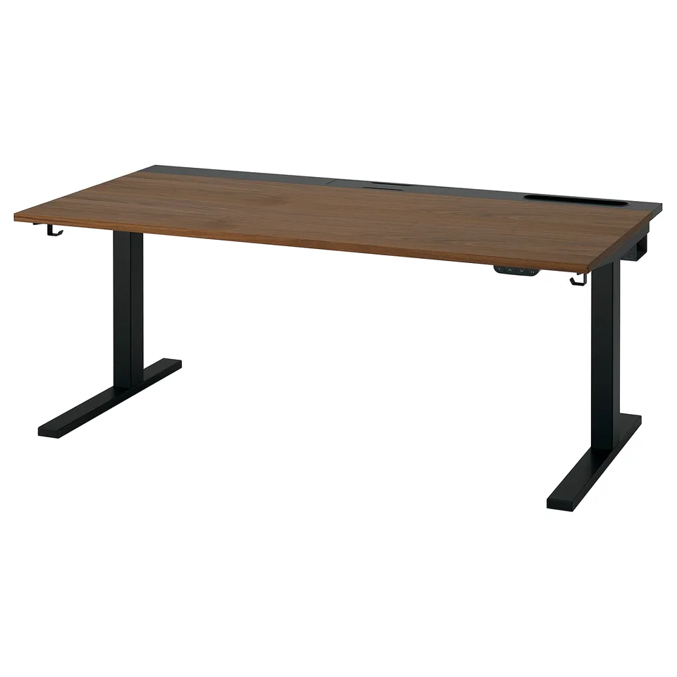 MITTZON sit-stand desk: brown wooden top, black metal legs, adjustable height, modern and ergonomic design.