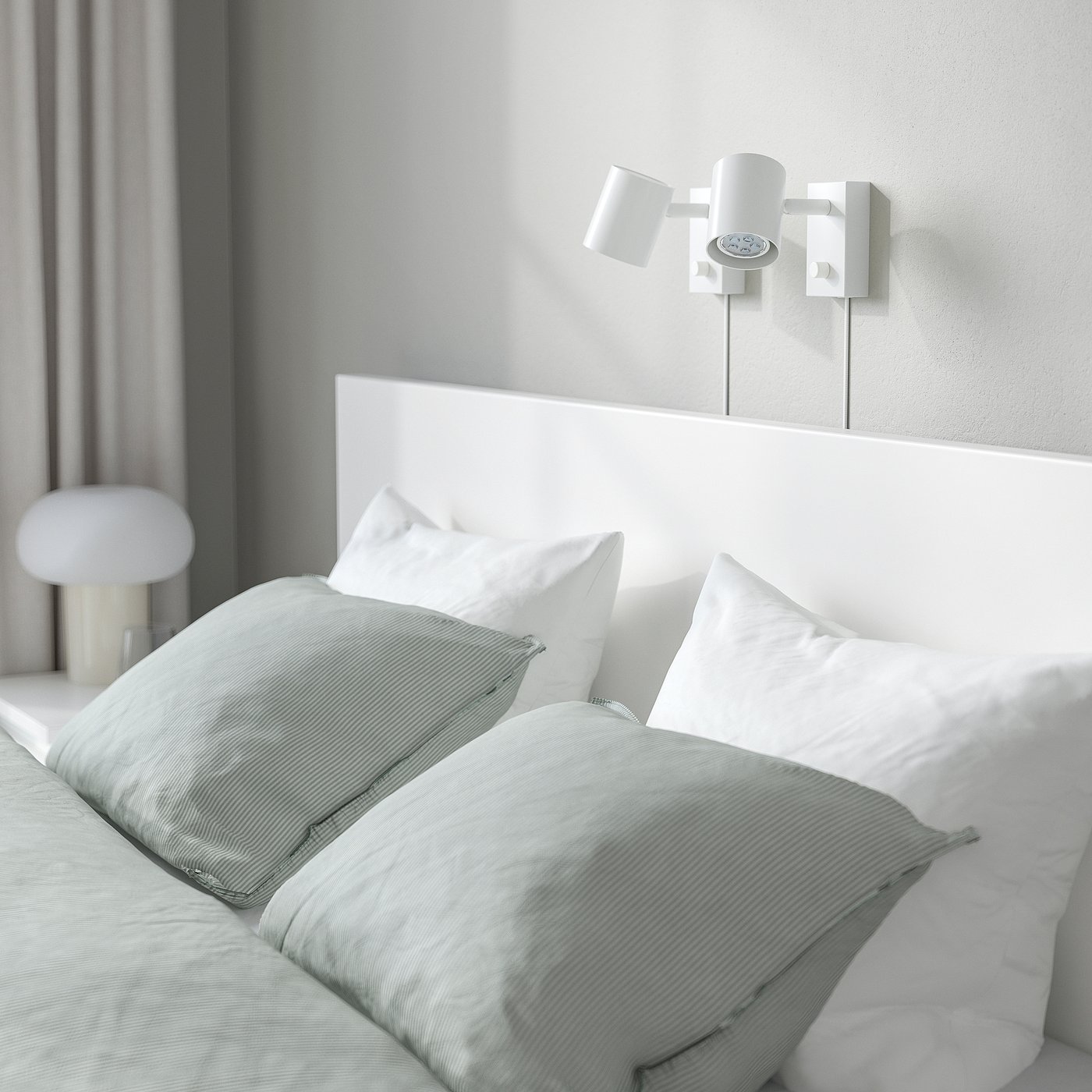 Modern adjustable bed with high headboard and built-in lights in minimalist bedroom.