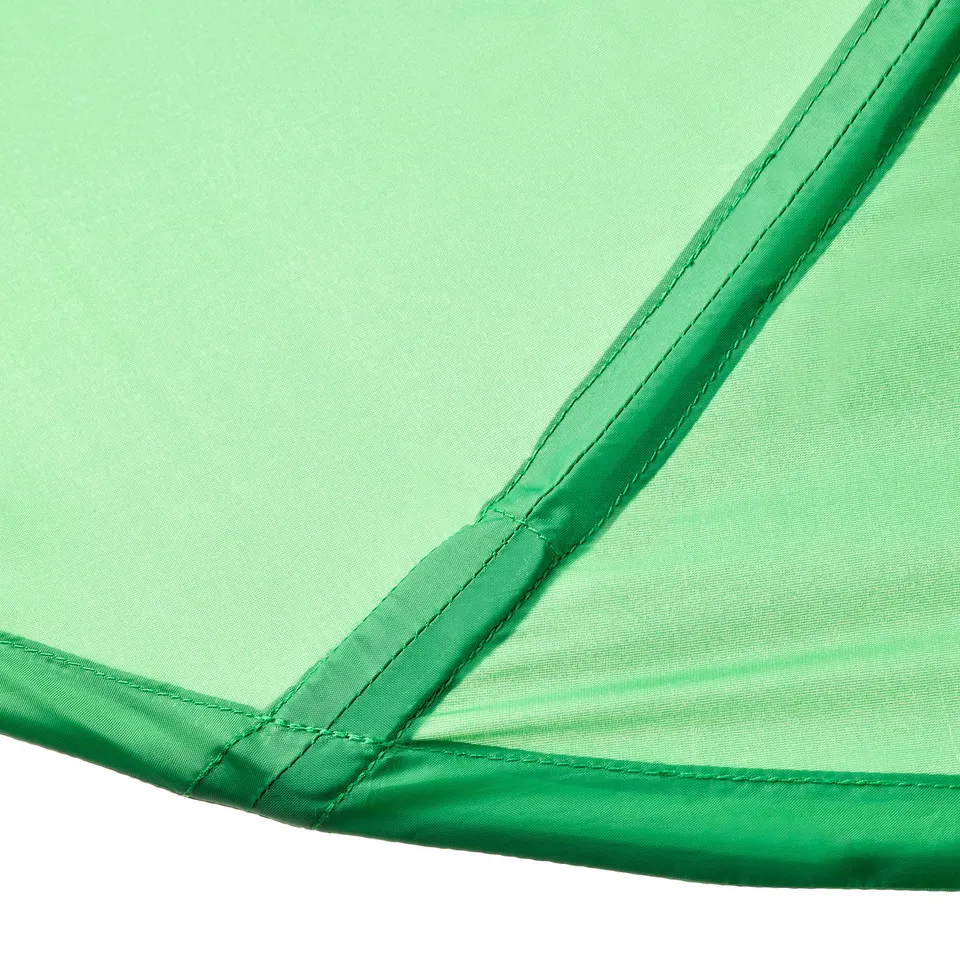 A corner of a green LÖVA bed canopy, highlighting its neat stitching and quality fabric.