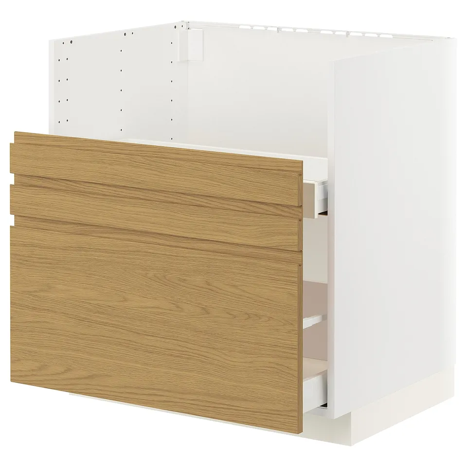 An ikea METOD kitchen cabinet with oak-colored wood texture, featuring multiple drawers and shelves, perfect for kitchen storage.