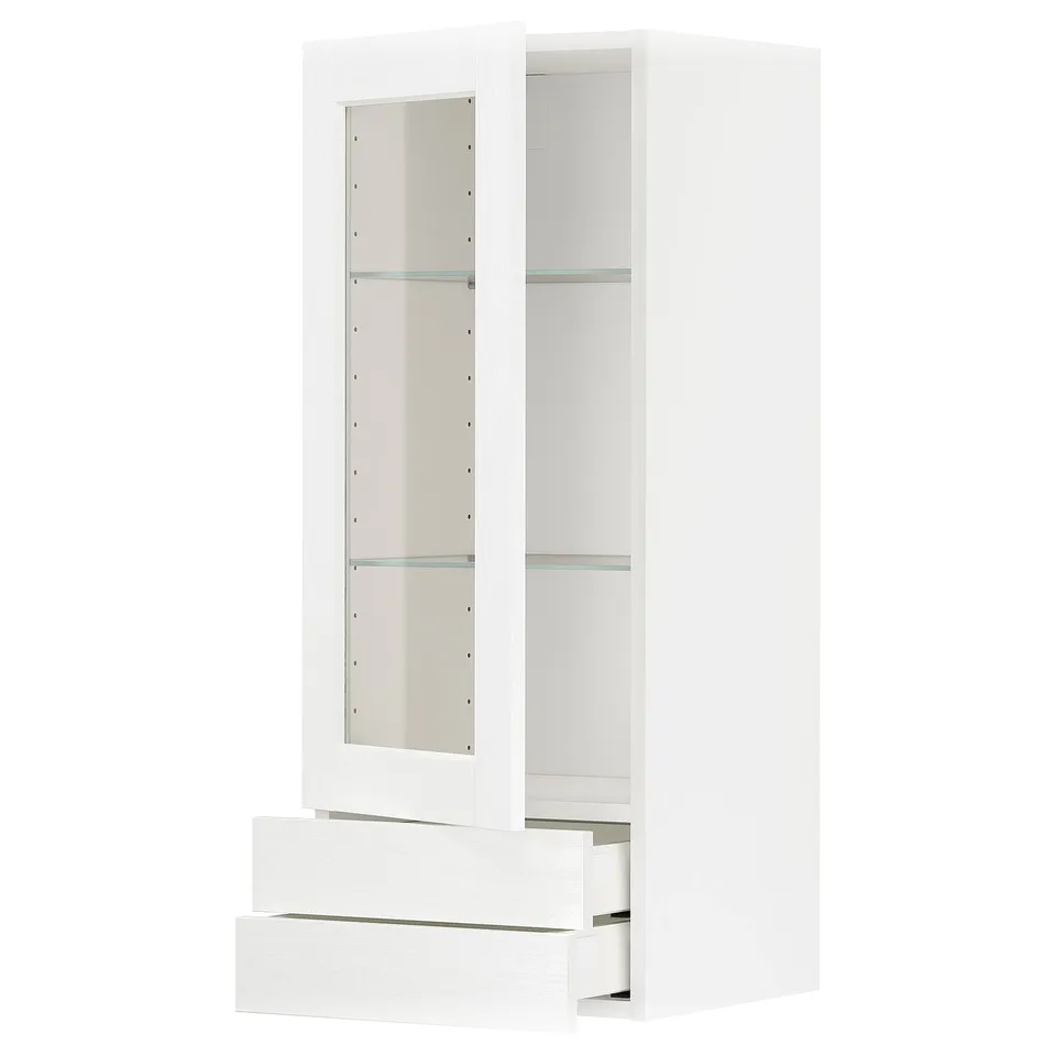 A white METOD kitchen cabinet with glass doors and drawers. It has a classic look with a sturdy frame and smooth-running drawers.