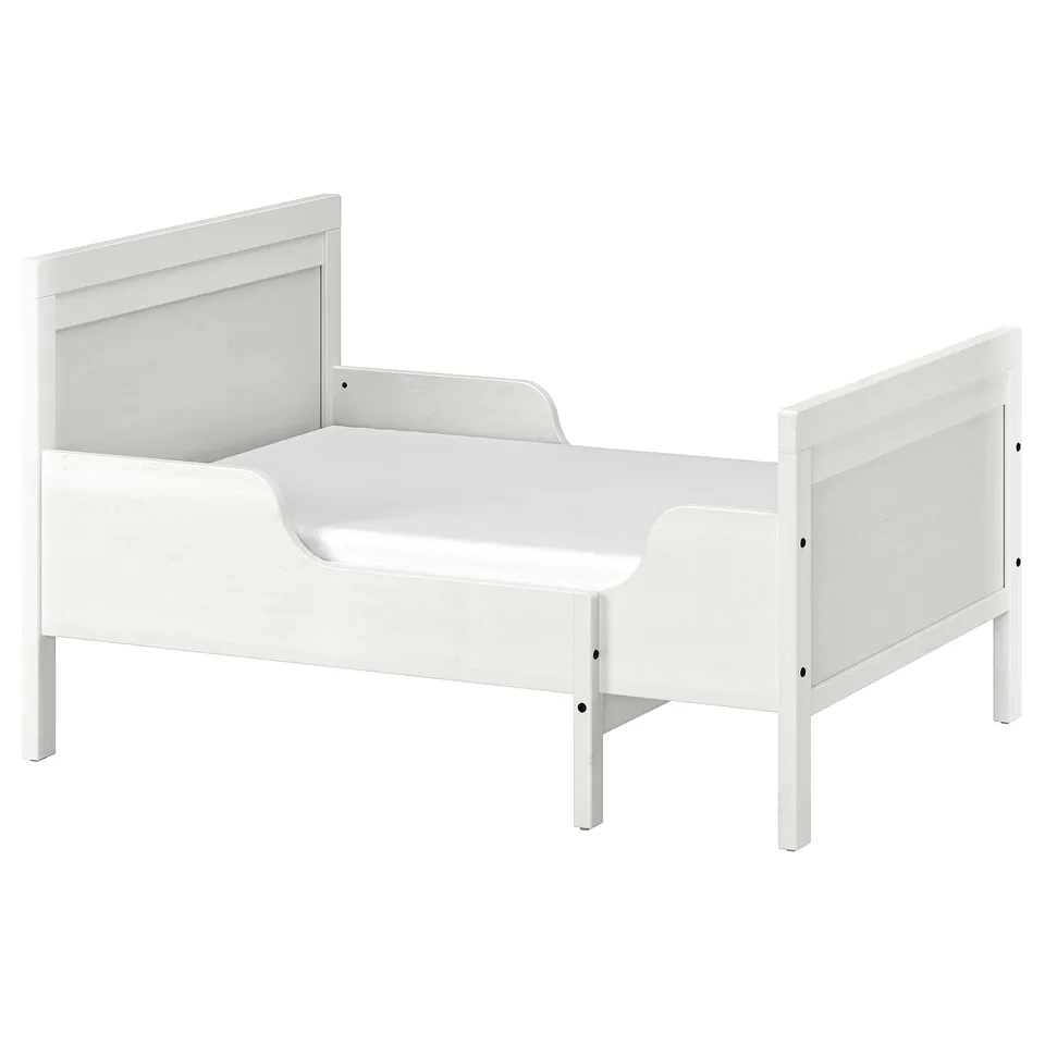 A white SUNDVIK toddler bed with extendable made from solid pine and fiberboard, designed for durability and timeless style.