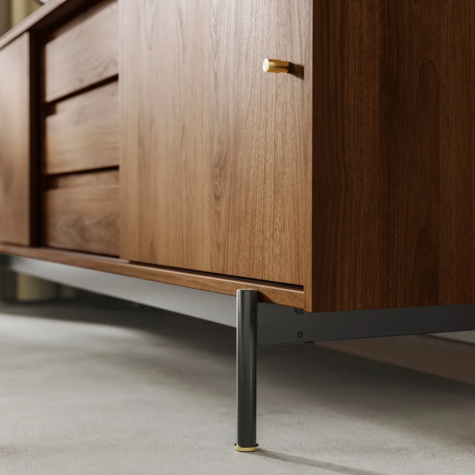 Mid-century modern cabinet with smooth wooden finish, gold handles, and sturdy black metal legs.