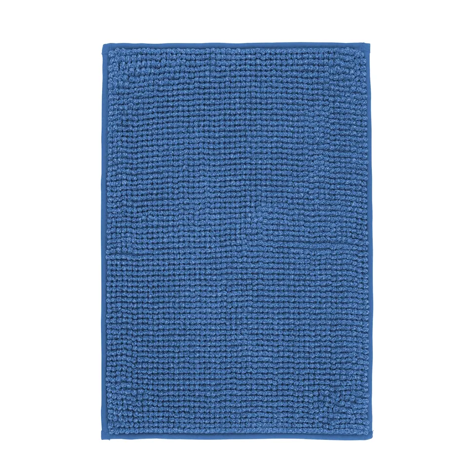 Blue TOFTBO bath mat, rectangular, textured soft surface.