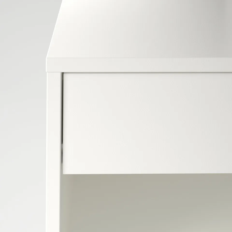 Modern white bedside table with sleek design and soft-close drawers.