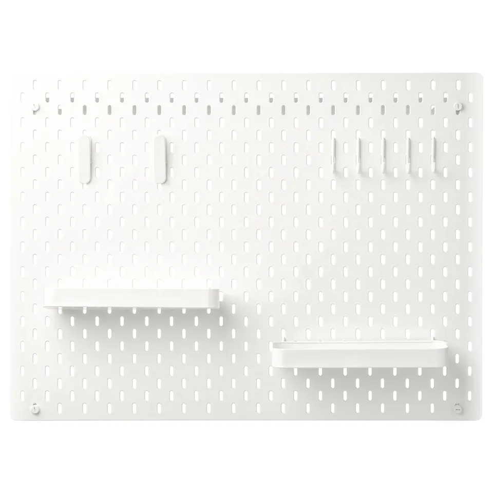SKÅDIS white pegboard with hooks and shelves for organising.