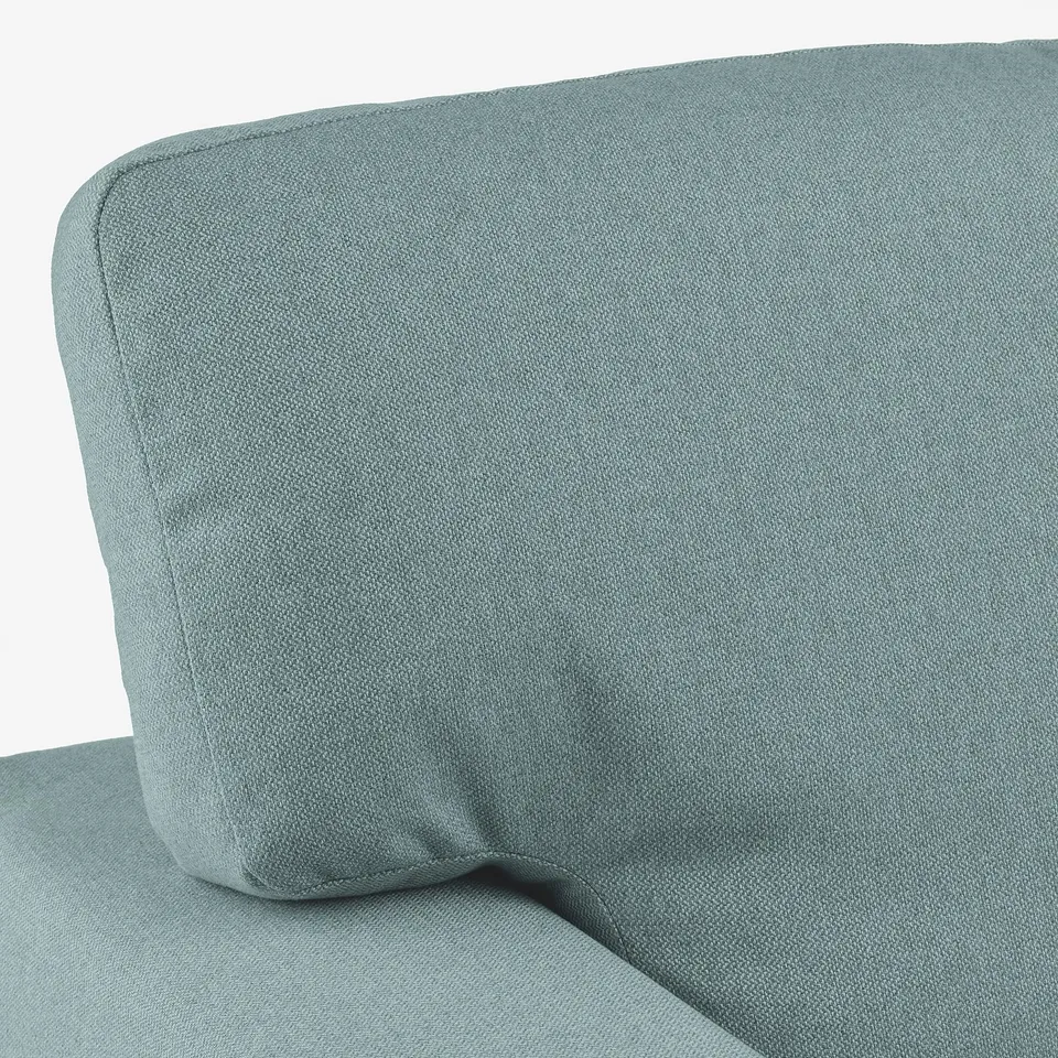 Soft, modern sofa with plush cushions. Light grey upholstery, ideal for comfort and style.