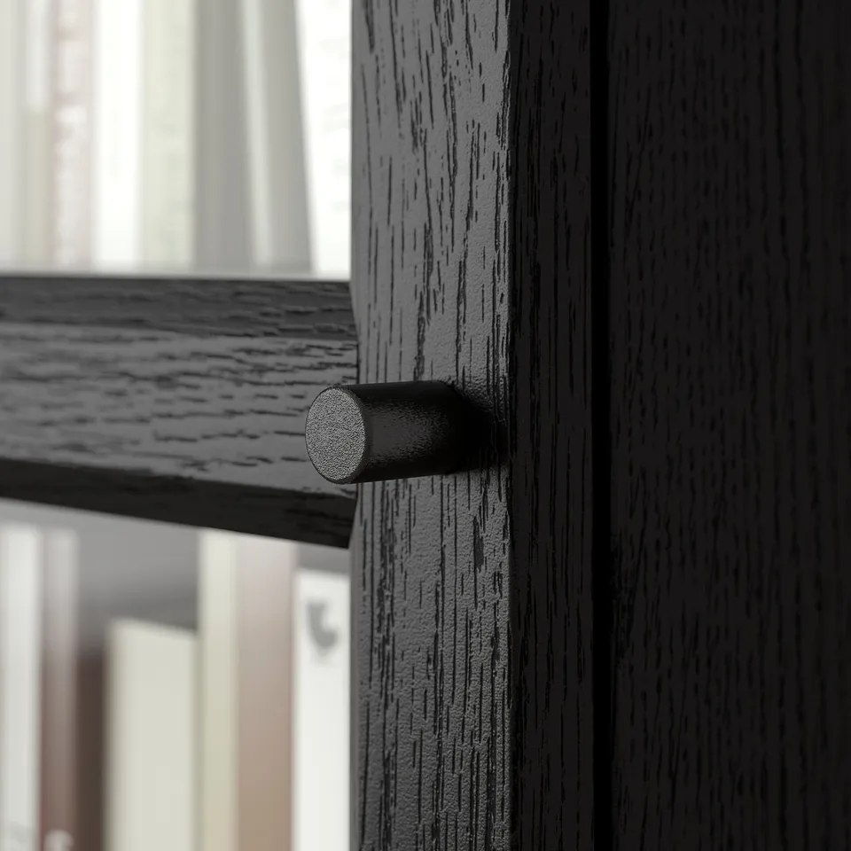 Black wooden drawer with cylindrical black handle, showcasing sleek design and high-quality finish.