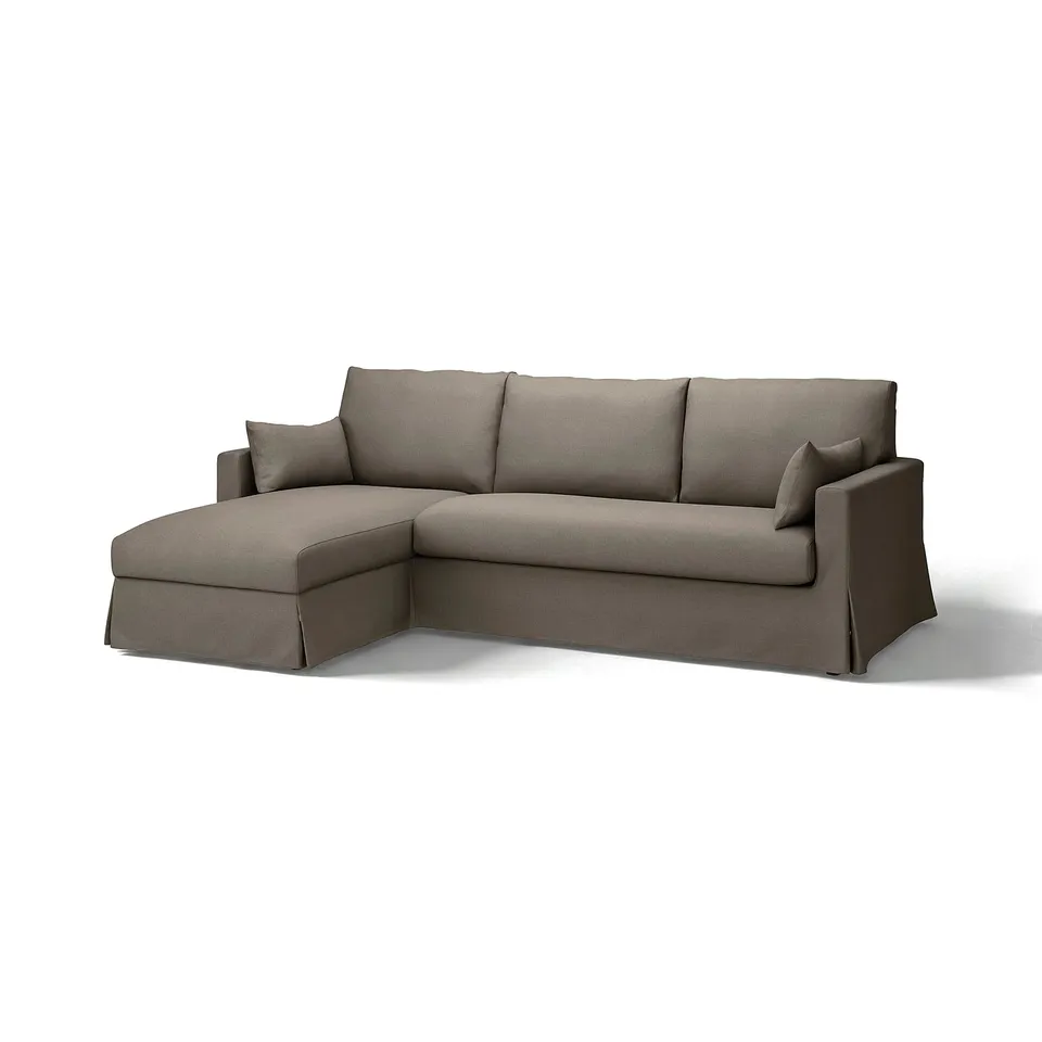 A brown l-shaped HYLTARP sofa with a chaise longue, a comfortable and clean design with a removable cover.