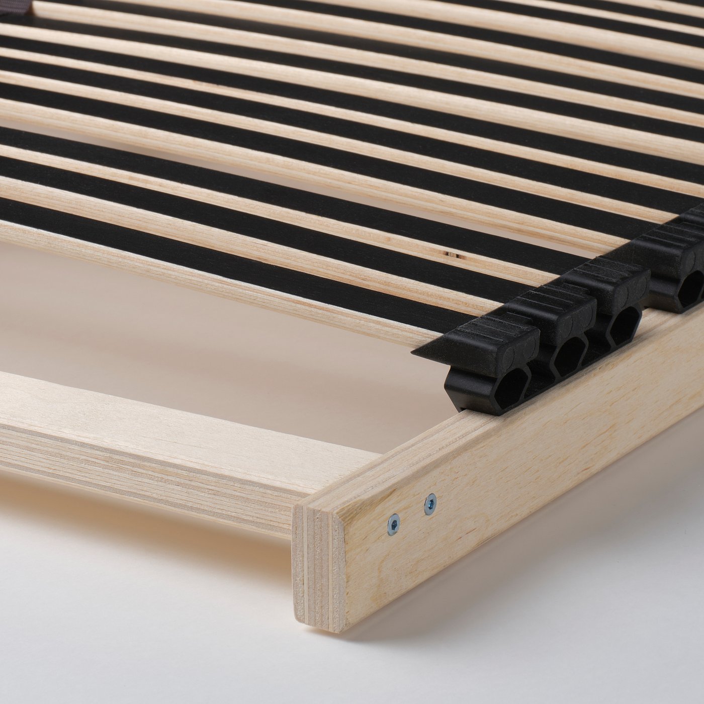 Wooden bed frame with adjustable slats, featuring sturdy legs and fitted with black plastic support clips.
