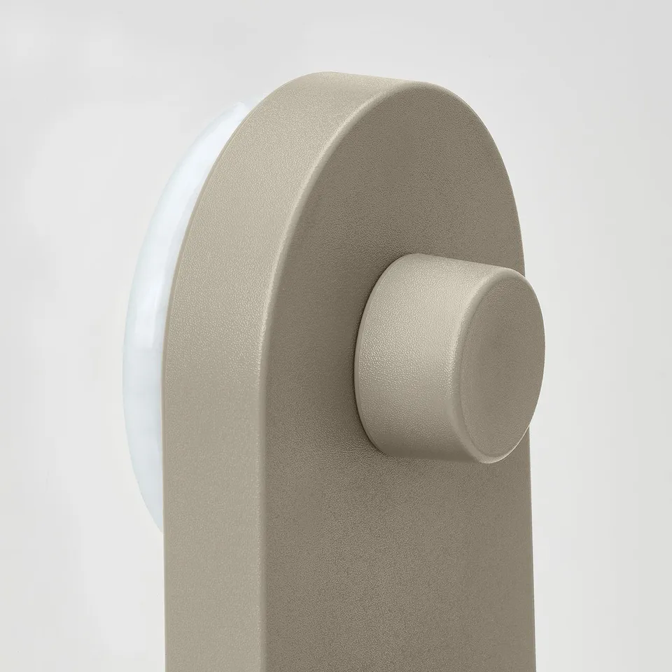 Modern beige wall organiser with seamless design and strong suction cup for secure hold.